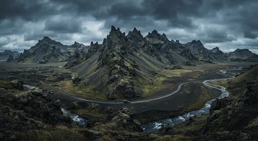 Jagged mountains beneath a heavy sky